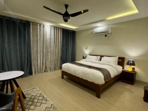 [IMAGE: Alt Text - Meechung Resort Skardu executive suite interior with mountain view]